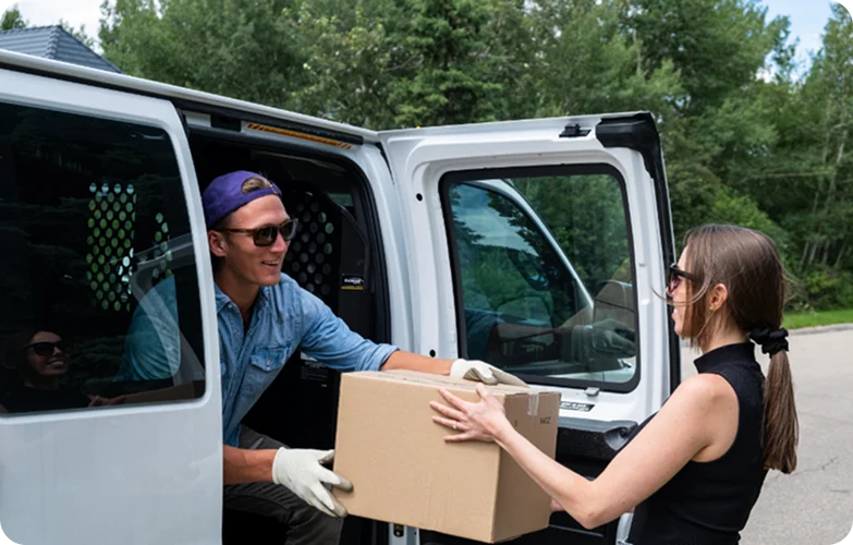 Professional house movers in Calgary loading moving truck for residential relocation